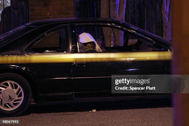 The body of a 13 year old boy lies dead in a car, one of numerous murders over a 24 hour period, on March 25, 2010 in Juarez, Mexico. Secretary of...