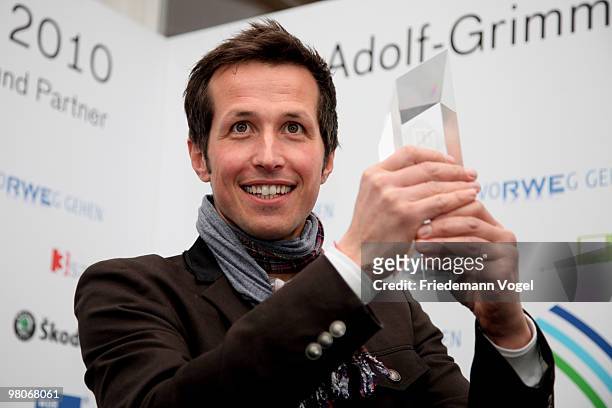 Host Helmar Weitzel poses at the Adolf Grimme Awards on March 26, 2010 in Marl, Germany. Helmar Weitzel received the award for his children's...