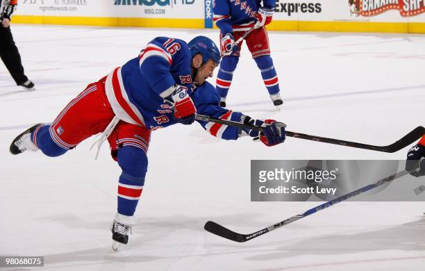 Sean Avery of the New York Rangers takes a shot in the second period against the New York Islanders on March 24, 2010 at Madison Square Garden in New...