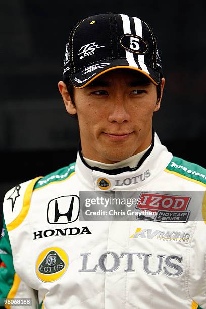 Takuma Sato of Japan, driver of the KV Racing Technology Dallara Honda, stands on pit road before practice for the IndyCar Series Honda Grand Prix of...