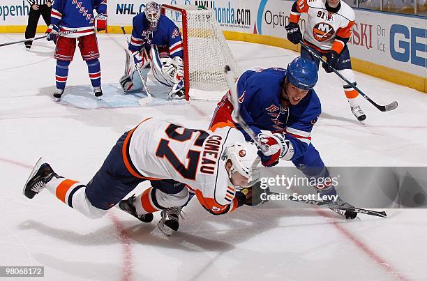 Marc Staal of the New York Rangers skates against Blake Comeau of the New York Islanders on March 24, 2010 at Madison Square Garden in New York City....