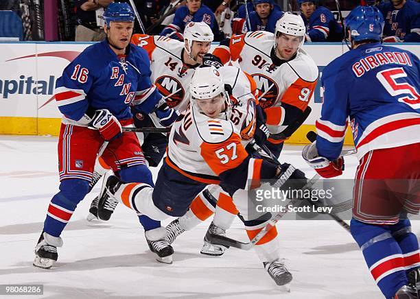 Blake Comeau of the New York Islanders takes a shot against the New York Rangers on March 24, 2010 at Madison Square Garden in New York City. The...