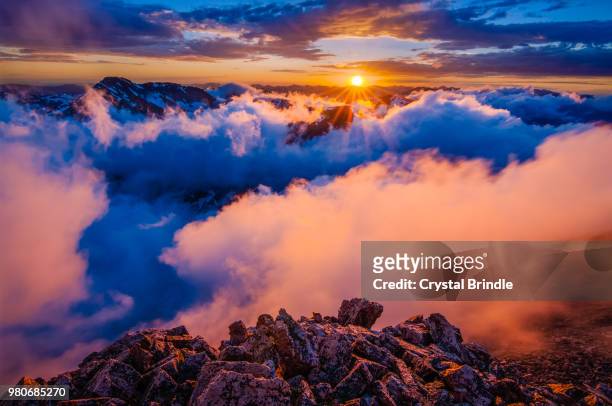 low hanging clouds over rocky mountain national park viewed from storm peak at sunset, colorado, usa - brindle stock pictures, royalty-free photos & images