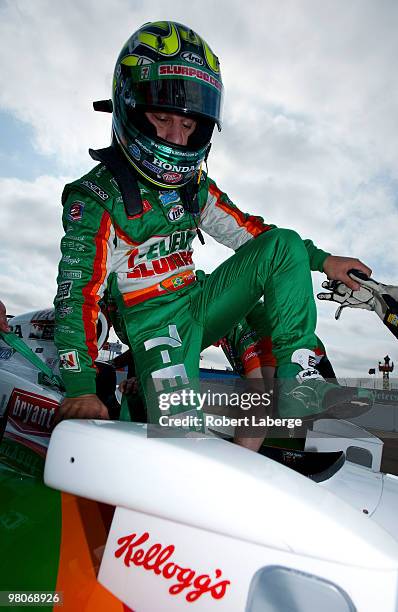 Tony Kanaan of Brazil driver of the Team 7-Eleven Andretti Autosport Dallara Honda gets into his car before the start of practice for the IndyCar...