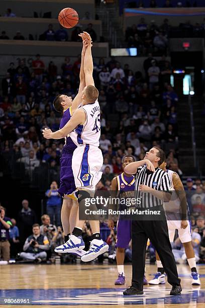 Cole Aldrich of the Kansas Jayhawks fights for control of the opening tip-off against Adam Koch of the Northern Iowa Panthers during the second round...