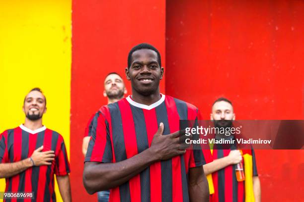 african ethnicity fan in front of players - traditional sport stock pictures, royalty-free photos & images