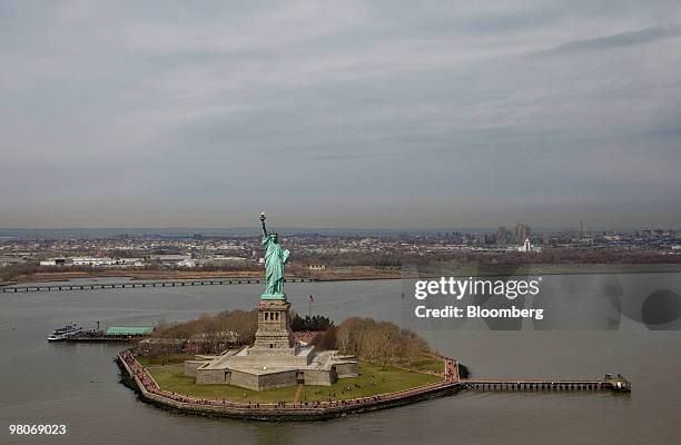 The Statue of Liberty stands on Liberty Island as viewed from an A-star 350 B-2 helicopter made by Eurocopter SA, one of six in the fleet of Liberty...