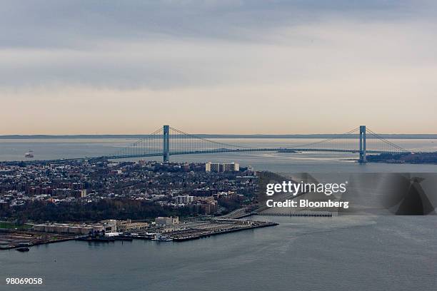 The Verrazano-Narrows Bridge leads into Brooklyn, left, as viewed from an A-star 350 B-2 helicopter made by Eurocopter SA, one of six in the fleet of...