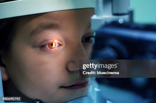 Girl Undergoing Eye Examination Girl Undergoing Eye Examination