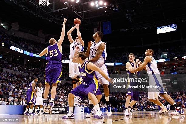 Cole Aldrich of the Kansas Jayhawks attempts a shot against Jordan Eglseder of the Northern Iowa Panthers during the second round of the 2010 NCAA...