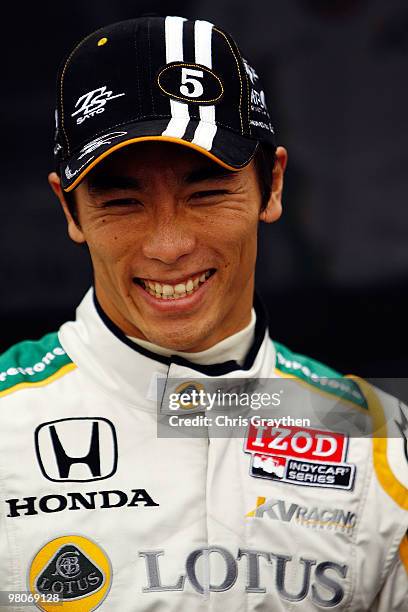 Takuma Sato of Japan, driver of the KV Racing Technology Dallara Honda, stands on pit road before practice for the IndyCar Series Honda Grand Prix of...