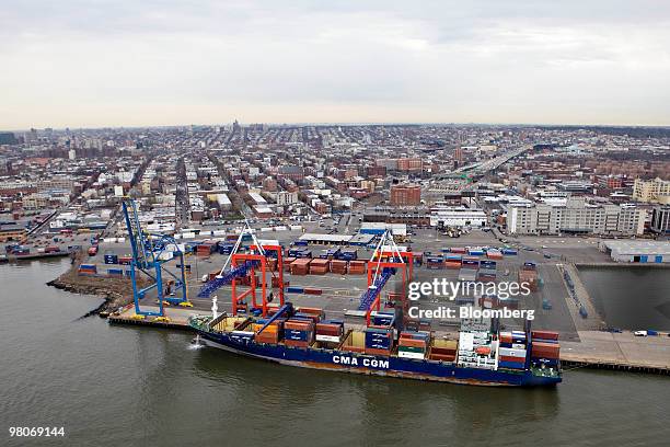 Container ship sits berthed at the Red Hook Container Terminal as viewed from an A-star 350 B-2 helicopter made by Eurocopter SA, one of six in the...