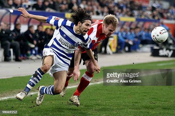Olcay Sahan of Duisburg is challenged by Tom Geissler of Koblenz during the Second Bundesliga match between MSV Duisburg and TuS Koblenz at the MSV...
