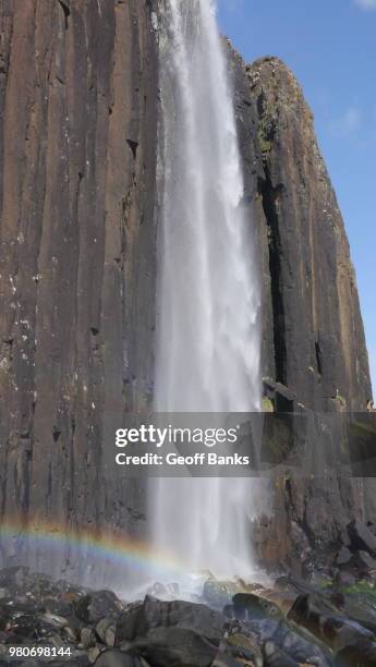 majestic waterfall with rainbow, isle of skye, scotland, uk - rainbow waterfall stock pictures, royalty-free photos & images