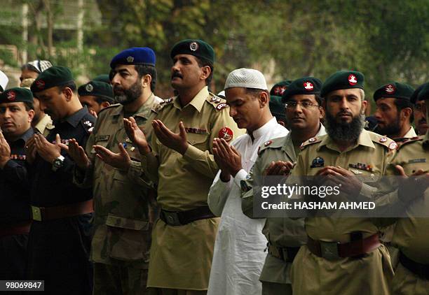 Pakistani military and paramilitary officials offer pray for a martyred army office,r killed during a military operation against militants during his...