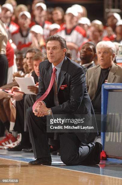 Rick Pitino, head caoch of the Louisville Cardinals, looks on during the Big East second round College Basketball Championship game against the...