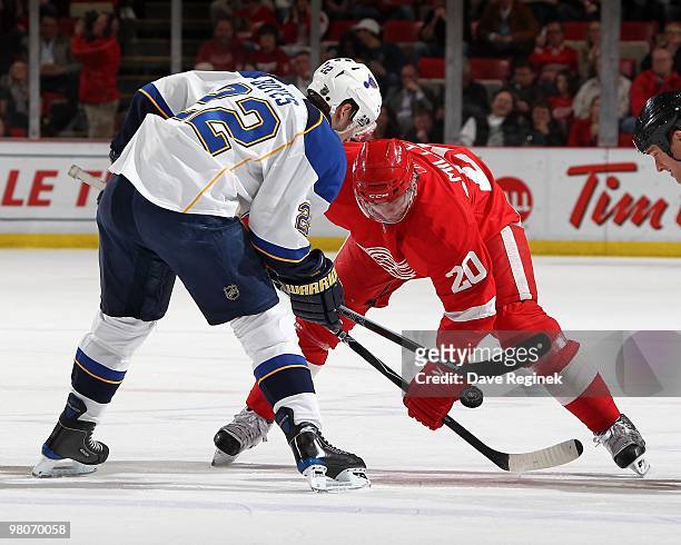 Brad Boyes of the St.Louis Blues faces off against Drew Miller of the Detroit Red Wings during an NHL game at Joe Louis Arena on March 24, 2010 in...