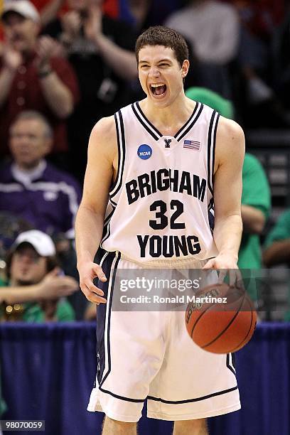 Jimmer Fredette of the BYU Cougars celebrates after BYU won in 99-92 double in overtime against the Florida Gators during the first round of the 2010...