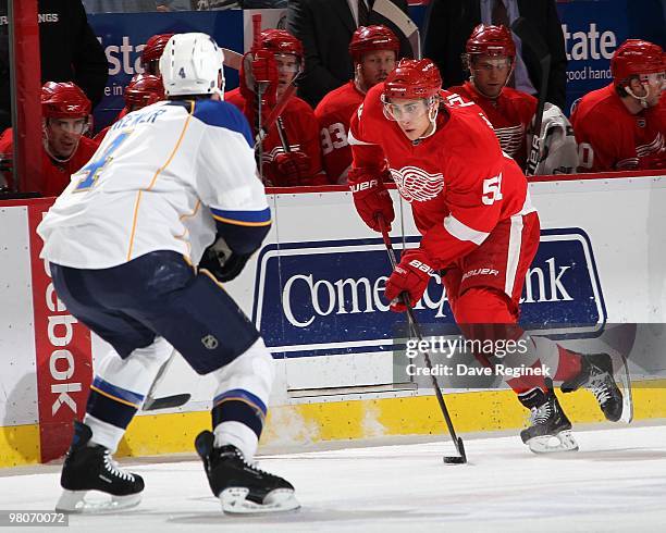 Valtteri Filppula of the Detroit Red Wings tries to skate by the defence of Eric Brewer of the St. Louis Blues during an NHL game at Joe Louis Arena...