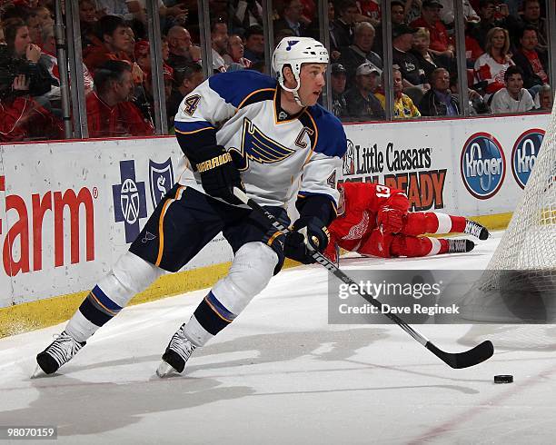 Eric Brewer of the St. Louis Blues skates with the puck during an NHL game against the Detroit Red Wings at Joe Louis Arena on March 24, 2010 in...