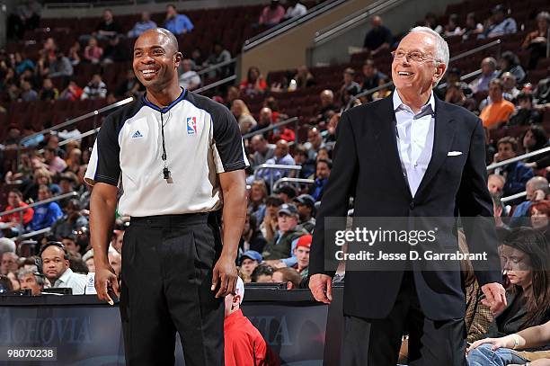Referee Courtney Kirkland and head coach Larry Brown of the Charlotte Bobcats smile on the court during the game between the Bobcats and the...