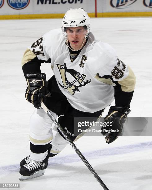 Sidney Crosby of the Pittsburgh Penguins turns up ice during an NHL game against the Detroit Red Wings at Joe Louis Arena on March 22, 2010 in...