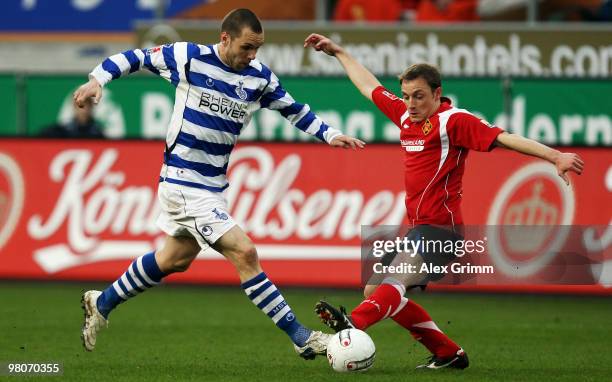 Christian Tiffert of Duisburg is challenged by Emmanuel Krontiris of Koblenz during the second Bundesliga match between MSV Duisburg and TuS Koblenz...