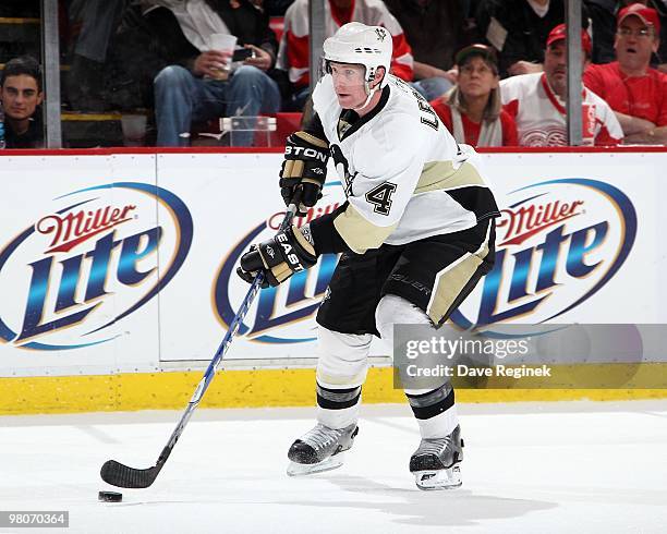 Jordan Leopold of the Pittsburgh Penguins skates with the puck during an NHL game against the Detroit Red Wings at Joe Louis Arena on March 22, 2010...