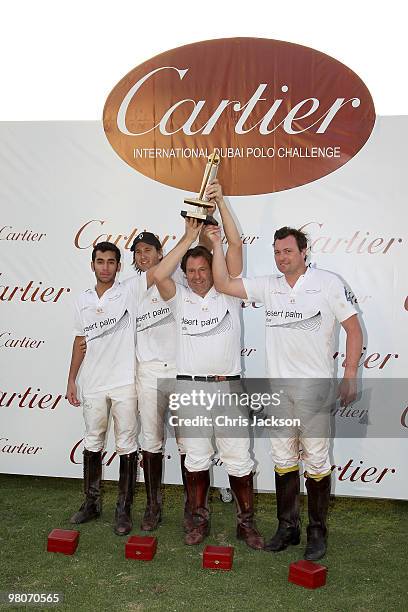 Team Desert Palm hold up their trophy at the Cartier International Dubai Polo Challenge at the Palm Desert Resort and Spa on March 26, 2010 in Dubai,...