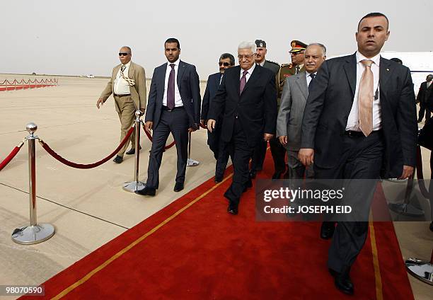 Palestinian president Mahmud Abbas is greeted by Libyan Prime Minister Baghdadi al-Mahmudi upon his arrival at the airport in the Libyan coastal city...