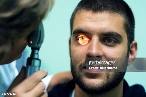 doing eye test - phoroptor stock pictures, royalty-free photos & images