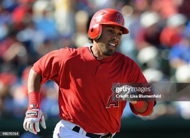 Maicer Izturis of the Los Angeles Angels of Anaheim walks onto the field before a Spring Training game against the Los Angeles Dodgers on March 15,...