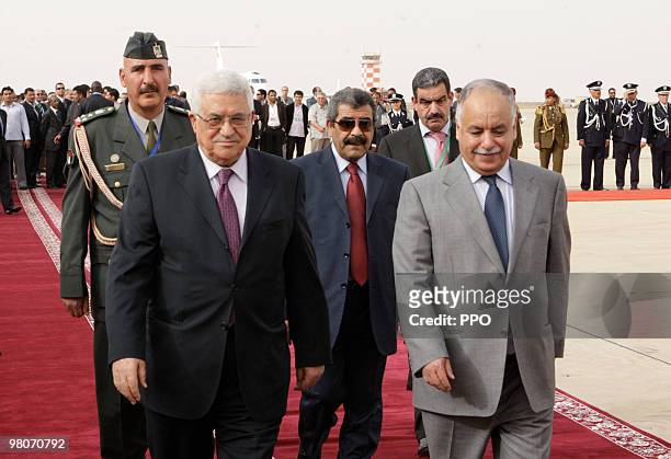 In this handout image supplied by the Palestinian Press Office , Palestinian President Mahmoud Abbas walks with Libyan Prime Minister Baghdadi...