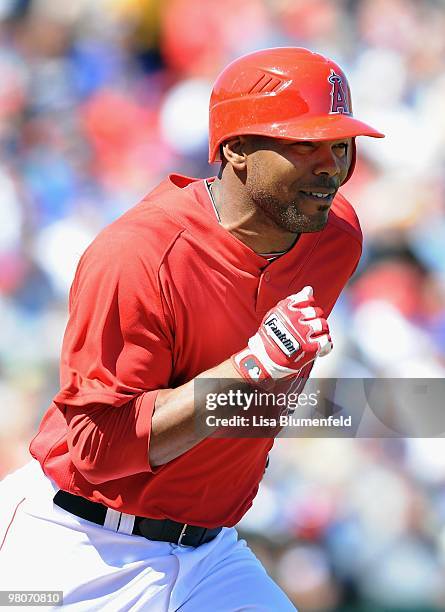 Howie Kendrick of the Los Angeles Angels of Anaheim runs to first base during a Spring Training game against the Los Angeles Dodgers on March 15,...