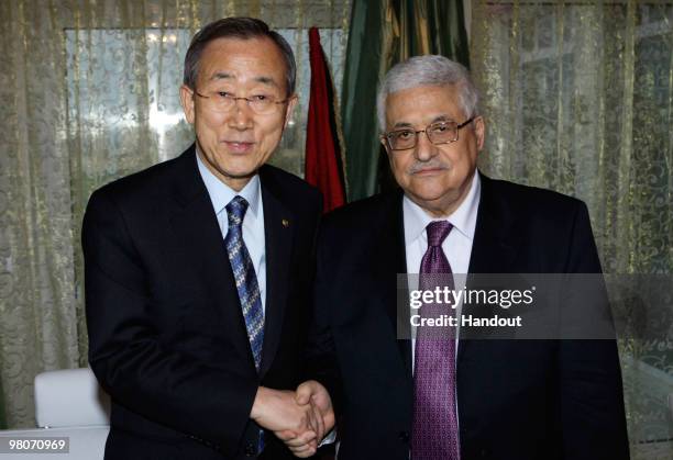 In this handout image supplied by the Palestinian Press Office , Palestinian President Mahmoud Abbas greets UN Secretary General Ban Ki-Moon in Sirte...