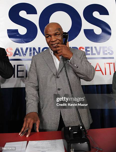 Boxer Mike Tyson answers phones at the BET-SOS Saving Ourselves � Help for Haiti Benefit Concert at AmericanAirlines Arena on February 5, 2010 in...