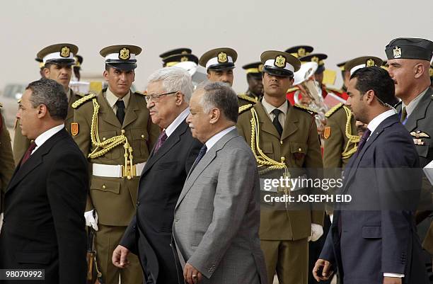 Palestinian president Mahmud Abbas is greeted by Libyan Prime Minister Baghdadi al-Mahmudi upon his arrival at the airport in the Libyan coastal city...