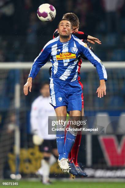 Stanislav Sestak of Bochum and Sebastian Jung of Frankfurt go up for a header during the Bundesliga match between VfL Bochum and Eintracht Frankfurt...