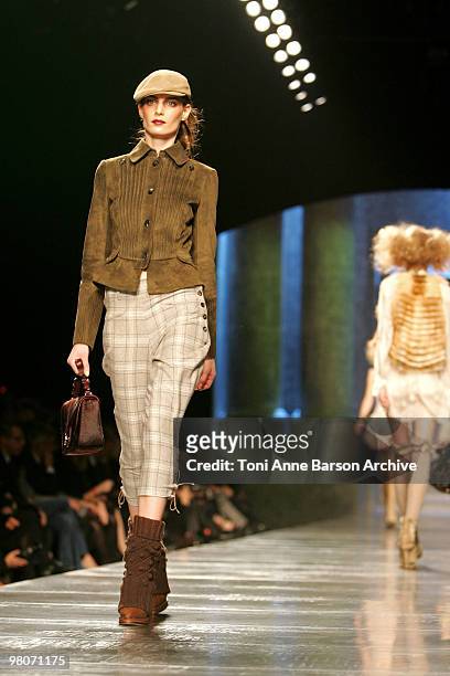 Model walks the runway during the Christian Dior Ready to Wear show as part of the Paris Womenswear Fashion Week Fall/Winter 2011 at Espace Ephemere...