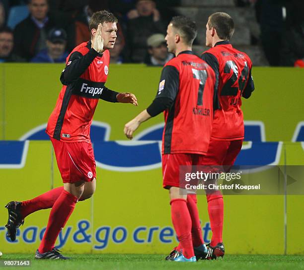 Marco Russ of Frankfurt celebrates the first goal with Benjamin Koehler and Sebastian Jung during the Bundesliga match between VfL Bochum and...