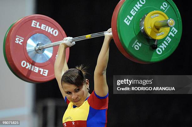 Venezuelan Betsi Rivas competes in the women's 48 kg weightlifting final to win the gold medal during the IX South American Games in Medellin,...