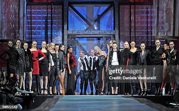 Dean Caten and Dan Caten aknowledge the applause of the public after the DSquared2 Milan Fashion Week Autumn/Winter 2010 show on February 26, 2010 in...