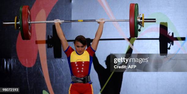 Venezuelan Betsi Rivas competes in the women's 48 kg weightlifting final to win the gold medal during the IX South American Games in Medellin,...