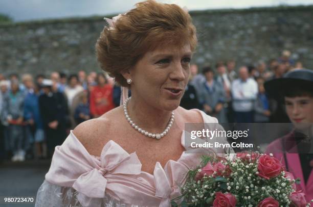 Guests attending the wedding of English tabloid journalist and broadcaster Derek Jameson and Ellen Petrie, Essex, UK, 9th March 1988.