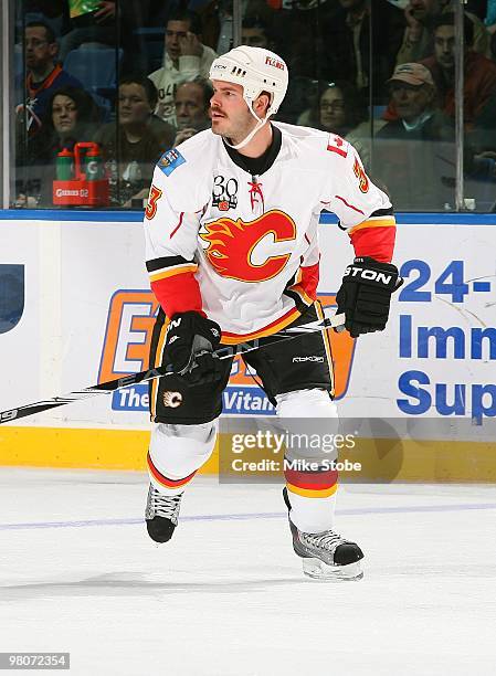 Ian White of the Calgary Flames skates against the New York Islanders on March 25, 2010 at Nassau Coliseum in Uniondale, New York. Islanders defeated...