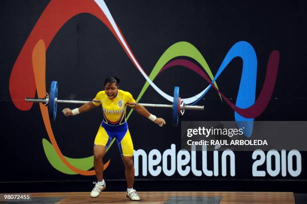 Ecuadorian Maria Vasquez Rivas competes in the women's 48 kg weightlifting final to win silver medal during the IX South American Games in Medellin,...