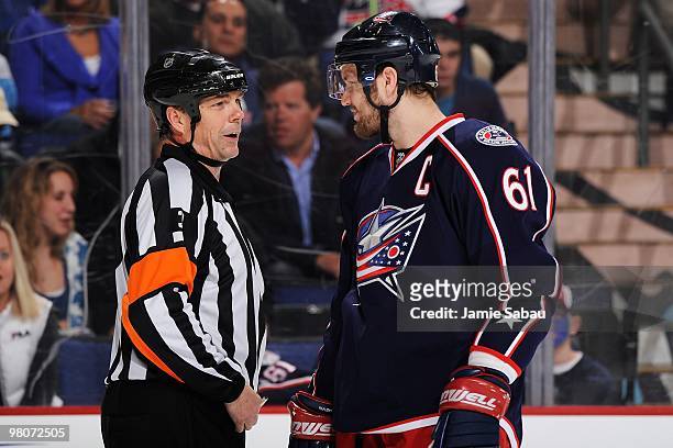 Referee Mike Leggo talks with forward Rick Nash of the Columbus Blue Jackets during game against the Chicago Blackhawks on March 25, 2010 at...