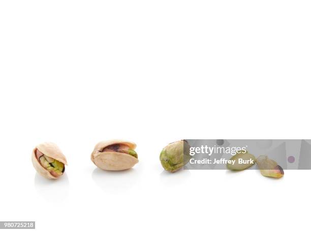 close up of pistachio nuts - pistachio stock pictures, royalty-free photos & images