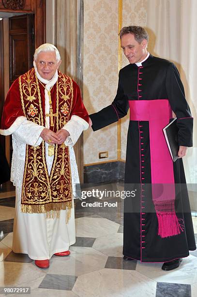 Pope Benedict XVI , flanked by his personal secretary Georg Ganswein, attends a meeting with Guatemala's president Alvaro Colom Caballeros at his...