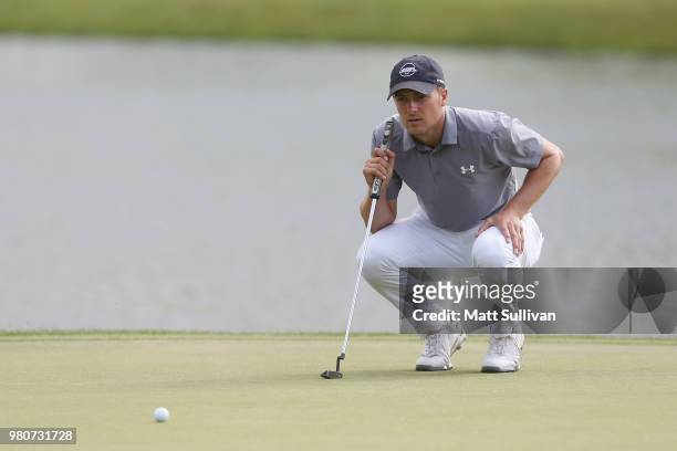 Jordan Spieth lines up a putt on the 17th hole during the first round of the Travelers Championship at TPC River Highlands on June 21, 2018 in...